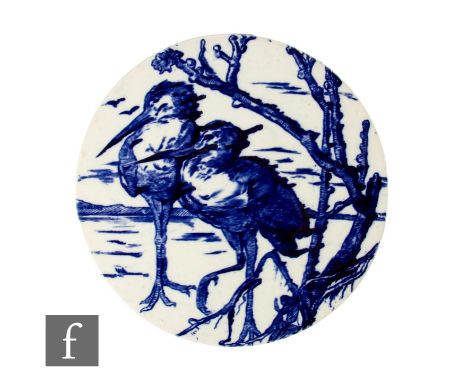 A large unmarked circular ceramic panel transfer printed with an underglaze blue and white design of two cranes by a tree, de