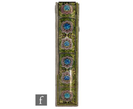 A 19th Century fireside run of tiles comprising 6 arched dust pressed tiles, each printed and painted with a stylised floral 