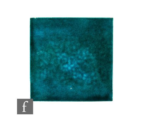 A 19th Century De Morgan, Iles &amp; Passenger 8 inch plastic clay tile, glazed with a mottled turquoise glaze, impressed D.I