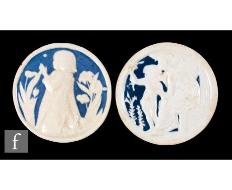 A late 19th Century Della Robbia Pottery Ltd of Birkenhead circular plastic clay roundel, relief moulded with a mother and ch