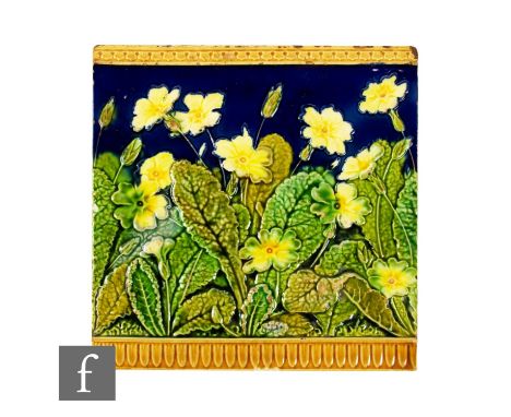 A late 19th Century Minton Hollins &amp; Co 8 inch press moulded plastic clay tile, relief moulded with a repeat frieze of pr