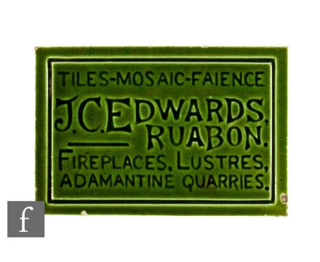 An early 20th Century dust pressed rectangular advertising tile for JC Edwards, the front impressed 'Tiles - Mosaic - Faience