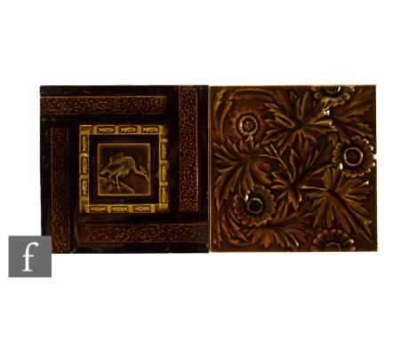 A 19th Century William Godwin of Hereford 6 inch dust pressed tile, relief moulded with a central image of a stylised crane w