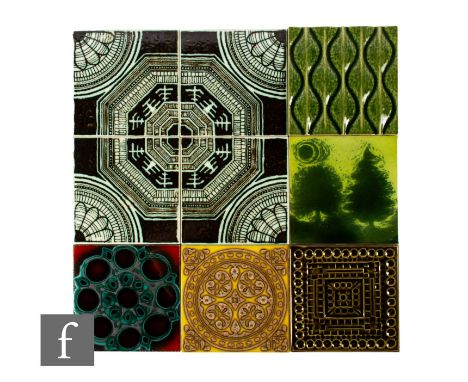 Four 20th Century H &amp; R Johnson 6 inch dust pressed tiles, decorated with circular and hexagonal shapes with banded decor