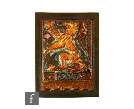 An early 20th Century Malkin dust pressed commemorative panel, decorated in high relief with a lion rampant, created for the 