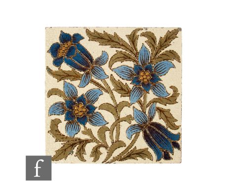 A later 19th Century Doulton &amp; Slater Paten 8 inch dust pressed tile, with incised blue floral motif and scrolling stylis