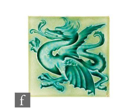A 20th Century Henry Richards Tile Company 6 inch dust pressed tile, decorated with a stylised dragon in blue glaze over a li