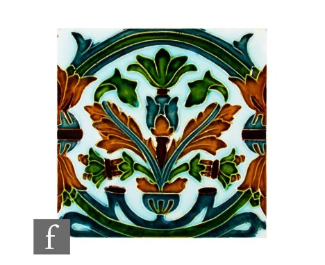 An early 20th Century Pilkington's 8 inch dust pressed tile, with faux tube lined decoration depicting a central stylised flo