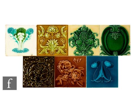 A collection of early 20th Century dust pressed 6 inch tiles, all with relief moulded Art Nouveau foliate decoration, to incl