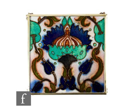 A 20th Century Carter &amp; Co Poole 6 inch framed tile, with faux tube lined large central stylised flower head and scrollin