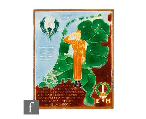 A Dutch Westraven tile tube line decorated with a solider saluting before an outline of the Netherlands, with a thistle to th