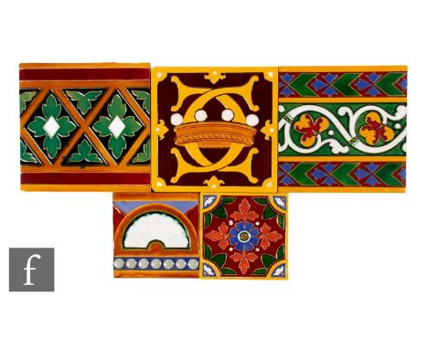 A collection of Minton dust pressed embossed pattern tiles, to include a 6 inch tile with a horizontal panel with foliate scr