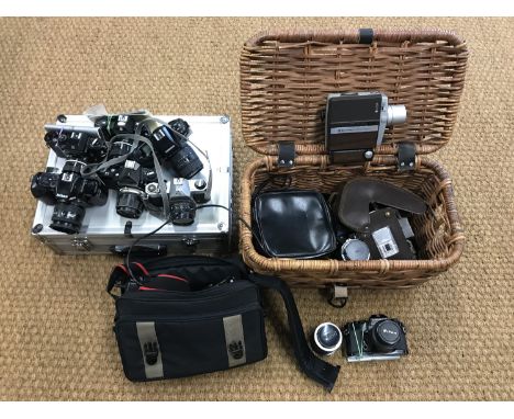 A quantity of cameras and lenses including a Nikon F-401S, a Nikkormat, a Nikomat, a Pentax Asahi K1000, a Nikon F90 together