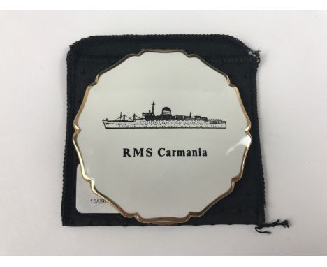 A vintage Stratton powder compact having a "RMS Carmania" cover