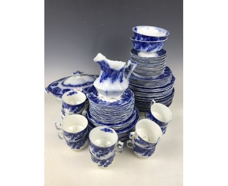 A quantity of late 19th Century Grindley's "flow blue" china, including a 'Brazil' pattern soup tureen and ladle, 'Argyle' pa