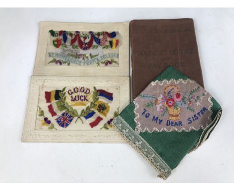 Military ephemera comprising a British Army Pay Book, two silk postcards and an embroidery