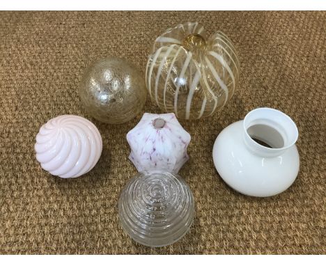 A number of early 20th Century glass light shades 