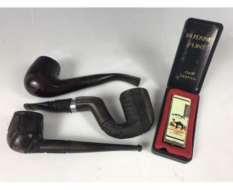 A vintage briar wood pipe together with two other pipes and a cased Camel Filters lighter