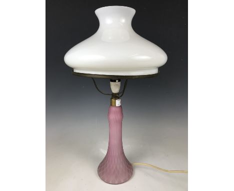 A pink opaline glass lamp base with shade