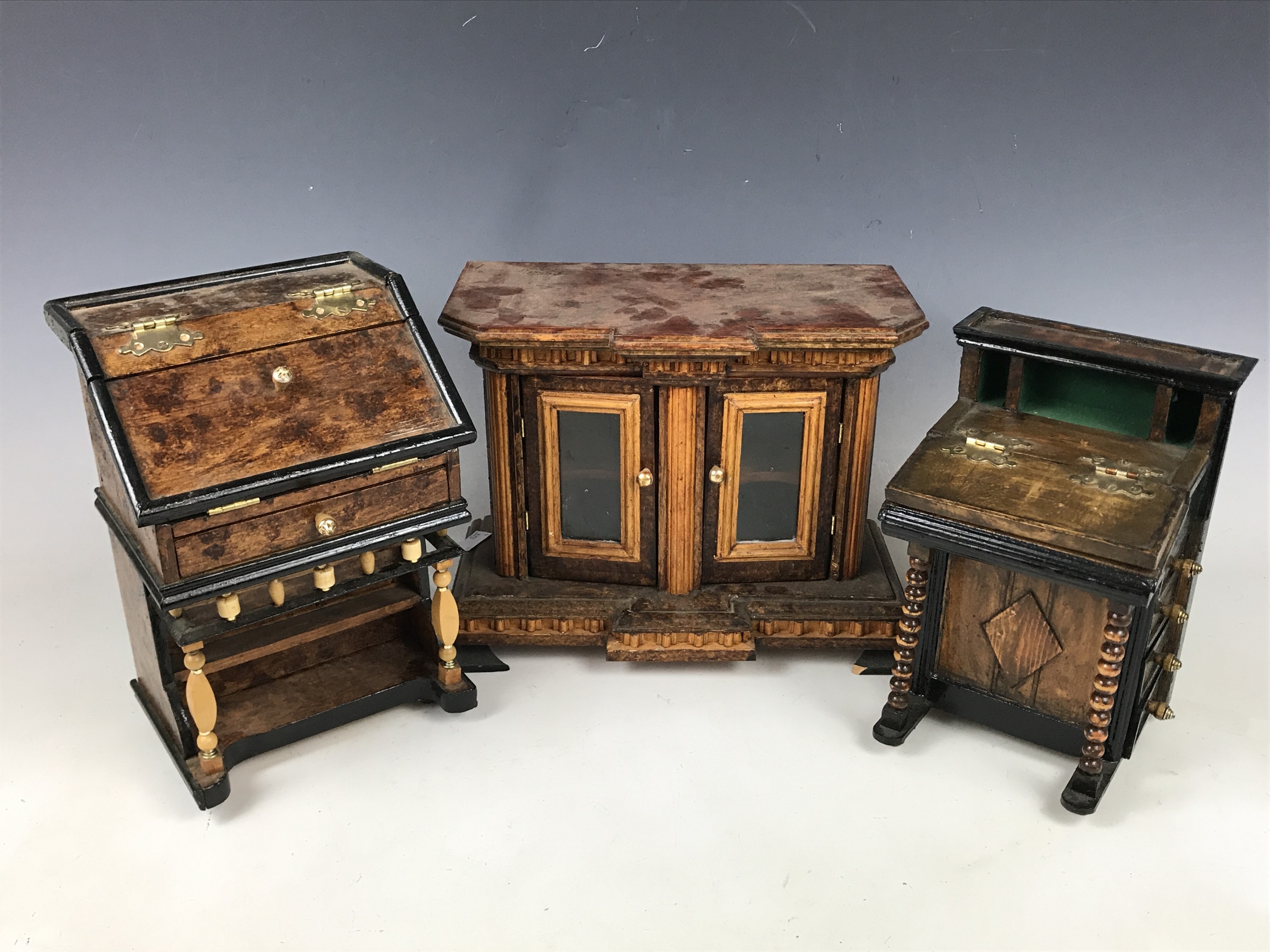 Three homemade dolls house furniture items including a Victorian style sideboard, a bureau and a Three homemade dolls house furniture items including a Victorian style sideboard, a bureau and a