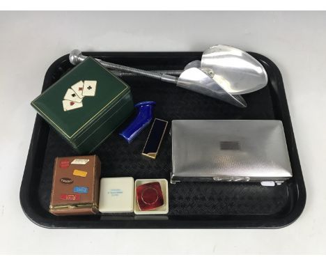 An electroplate cigarette box together with a boxed pocket ashtray, a cigarette lighter and a tooled leather playing card hol