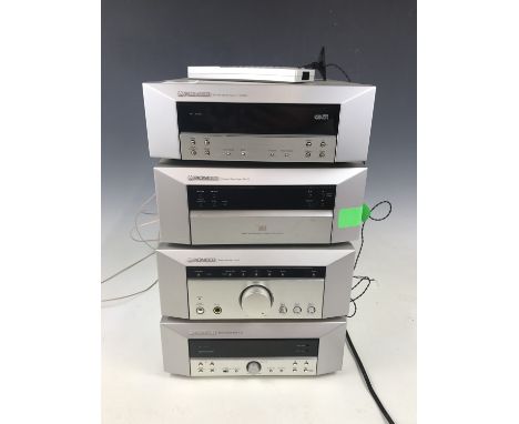 A Pioneer stereo system comprising fm / am stereo tuner F-CSRDS, a cassette deck T-C3, a stereo amplifier A-C5 and a compact 