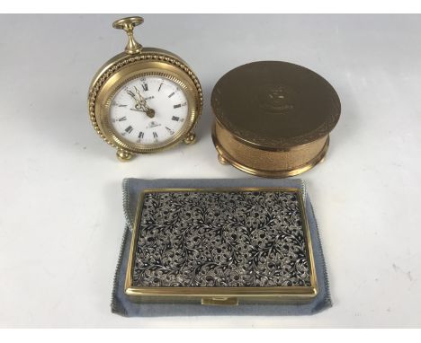 A novelty Swiza alarm clock together with a Sonata musical compact and one other compact