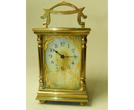 A brass carriage timepiece, with an enamel dial and blue numbers