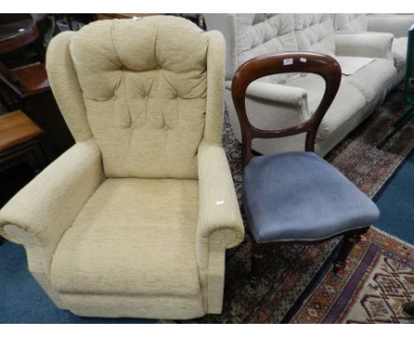 A cream upholstered button back wingback armchair and a Victorian mahogany balloon back dining chair.