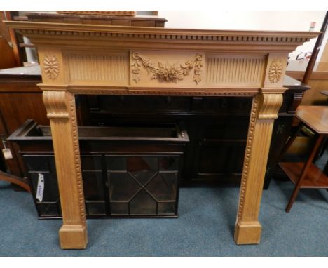 A 20th century pine Adam style fire surround *