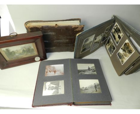 A selection of leather and other bound black and white photograph albums, including an example with inscription 'From Colonel