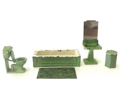 A Dinky Toys No 104 pre-war set of diecast bathroom furniture in mottled green, comprising a bath, toilet, laundry basket, ba