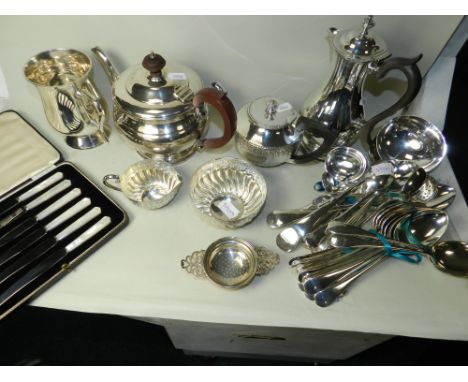 Silver-plated wares to include Mappin and Webb examples, spoons, ladles, tea strainer, teapots, mother-of-pearl handled knive