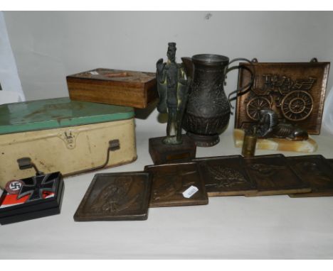A group of cast metal tiles, decorated with various animals, together with a metal plaque of a Daimler Motorkutsche, a decora