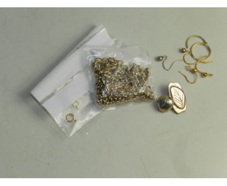 A yellow metal chain stamped 9ct together with further yellow metal chains and yellow metal items.