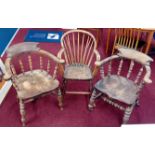 Three wood armchairs from the studio of Robert Lenkiewicz, turned backs and legs, one on casters.