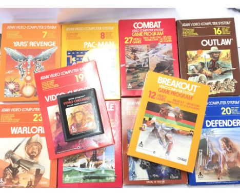 A Box Containing A Vintage Atari Video Computer System With 10 Boxed Games and Comtrollers.