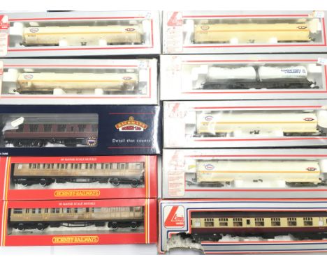 A Box Containing a Collection of Boxed 00 Gauge Rolling Stock and Coaches. Including Lima. Hornby and Bachmann.