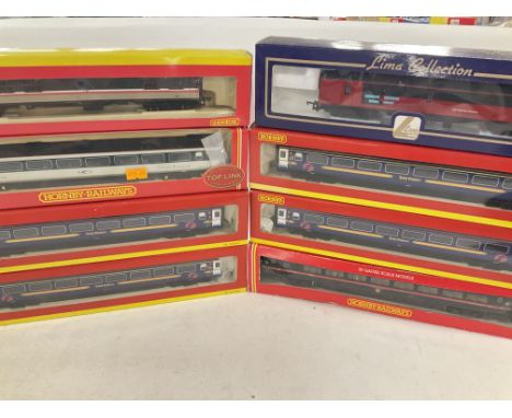 A Box Containing a Collection of Boxed 00 Gauge Hornby and Lima Coaches.