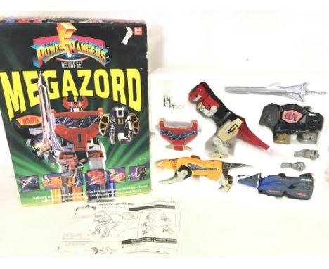 A Boxed Vintage Ban Dai Power Rangers Megazord Deluxe Set.
