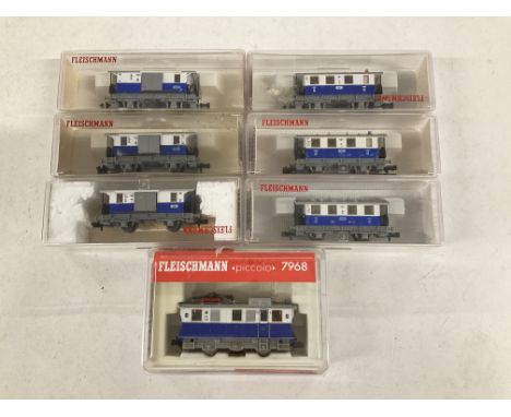 A Boxed Fleischmann N Gauge Track Cleaning Locomotive with 6 Carriages.
