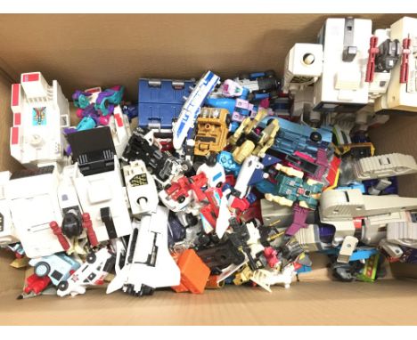 A Box Containing A Collection of Vintage Generation 1 Transformers.