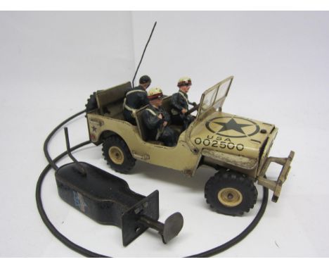 An Arnold (Germany) tinplate US military Jeep no.2500 in tan colourway, complete with compisition figures of radio serviceman