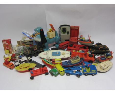 A collection of predominantly 1970s playworn plastic and tinplate toys including Marx plastic battery operated tank, Cragstan