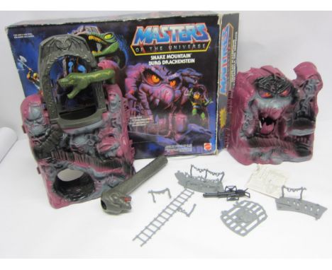 A boxed Mattel Masters of the Universe Snake Mountain action figure playset, housed in original box, no action figures presen