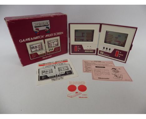 Nintendo Game &amp; Watch Multi Screen Mario Bros. handheld electronic game (MW-56) in original box, Number 45989982, box is 