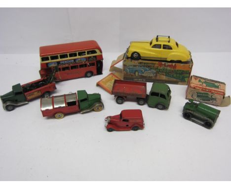 A boxed Triang Minic Series No.2 Wizard Stop On Car (one box end flap detached), together with assorted playworn tinplate clo