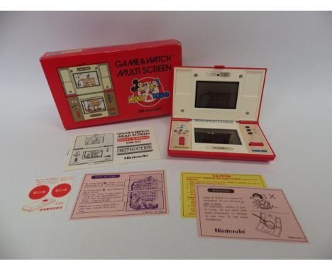 Nintendo Game &amp; Watch Multi Screen Mickey &amp; Donald handheld electronic game (DM-53) in original box, Number 33261402.