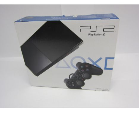 A sealed PlayStation 2 slim games console in charcoal black, SCPH-90004 CB. Still has the PlayStation sticker seal on the box