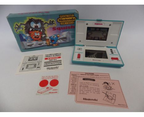 Nintendo Game &amp; Watch Multi Screen Squish handheld electronic game (MG-61) in original box, Number 41938422. Box has some